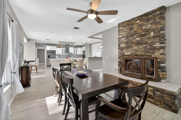 a spacious bathroom with a double vanity sink a mirror and a shower