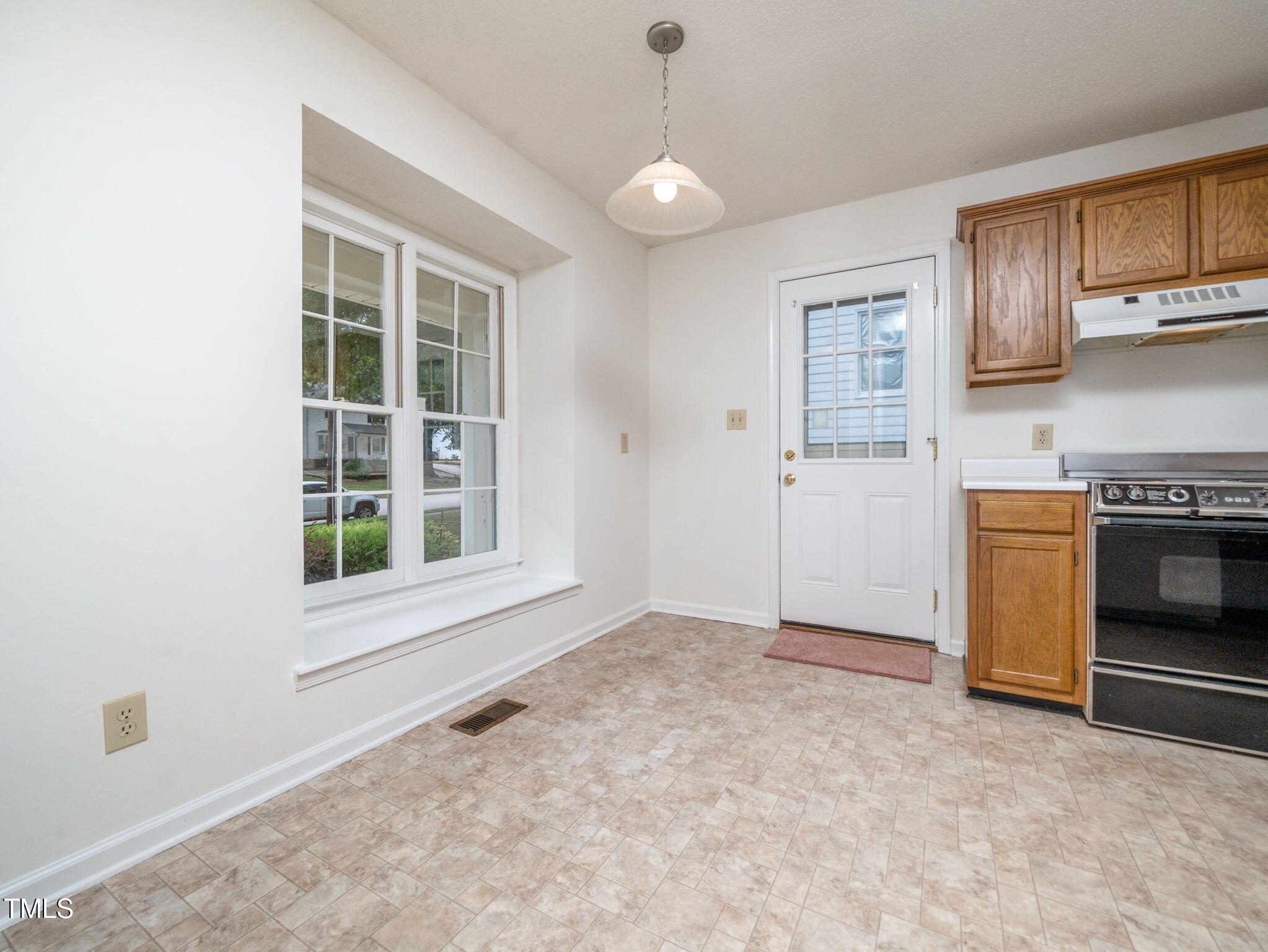 5148 Wallingford Drive Raleigh, NC 27616 - Photo 17 of 30 Kitchen with Side Entrance