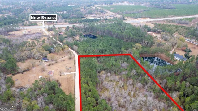 a front view of a house with a yard and fountain