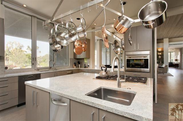 71172 La Paz Road Rancho Mirage, CA 92270 - Photo 16 of 51 a kitchen with a sink a counter space and stainless steel appliances
