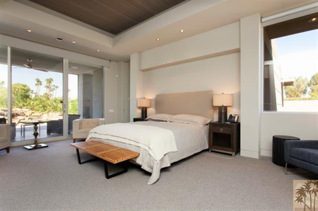 71172 La Paz Road Rancho Mirage, CA 92270 - Photo 19 of 51 a spacious bedroom with a bed and large windows