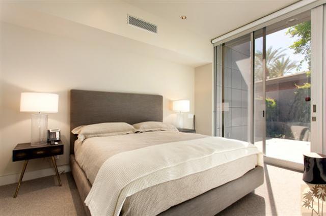 71172 La Paz Road Rancho Mirage, CA 92270 - Photo 23 of 51 a bedroom with a bed and a lamp next to a window