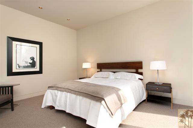 71172 La Paz Road Rancho Mirage, CA 92270 - Photo 26 of 51 a bedroom with a bed and a lamp on dresser