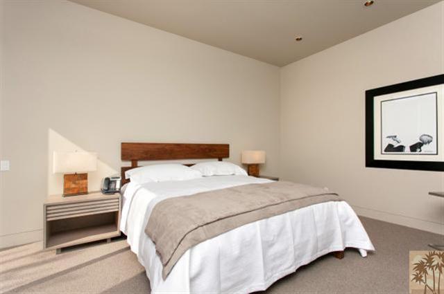 71172 La Paz Road Rancho Mirage, CA 92270 - Photo 28 of 51 a bedroom with a bed and a painting on the wall