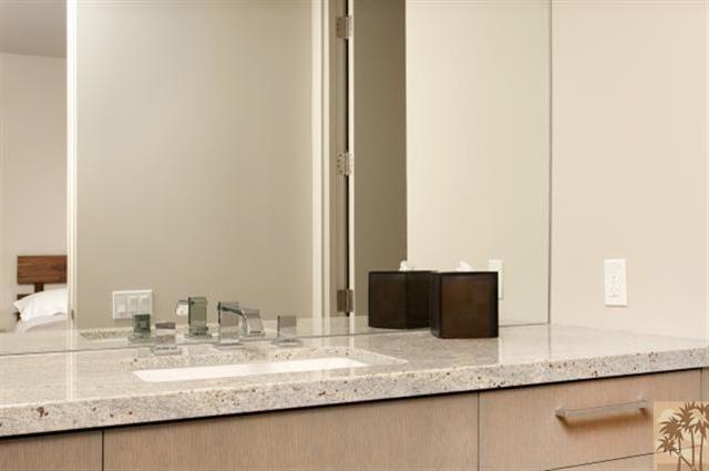 71172 La Paz Road Rancho Mirage, CA 92270 - Photo 29 of 51 a bathroom with a granite countertop sink and a mirror