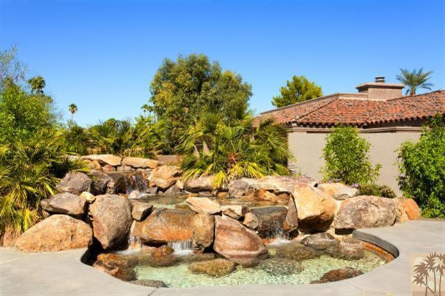 71172 La Paz Road Rancho Mirage, CA 92270 - Photo 39 of 51 a view of a swimming pool with some plants and large trees