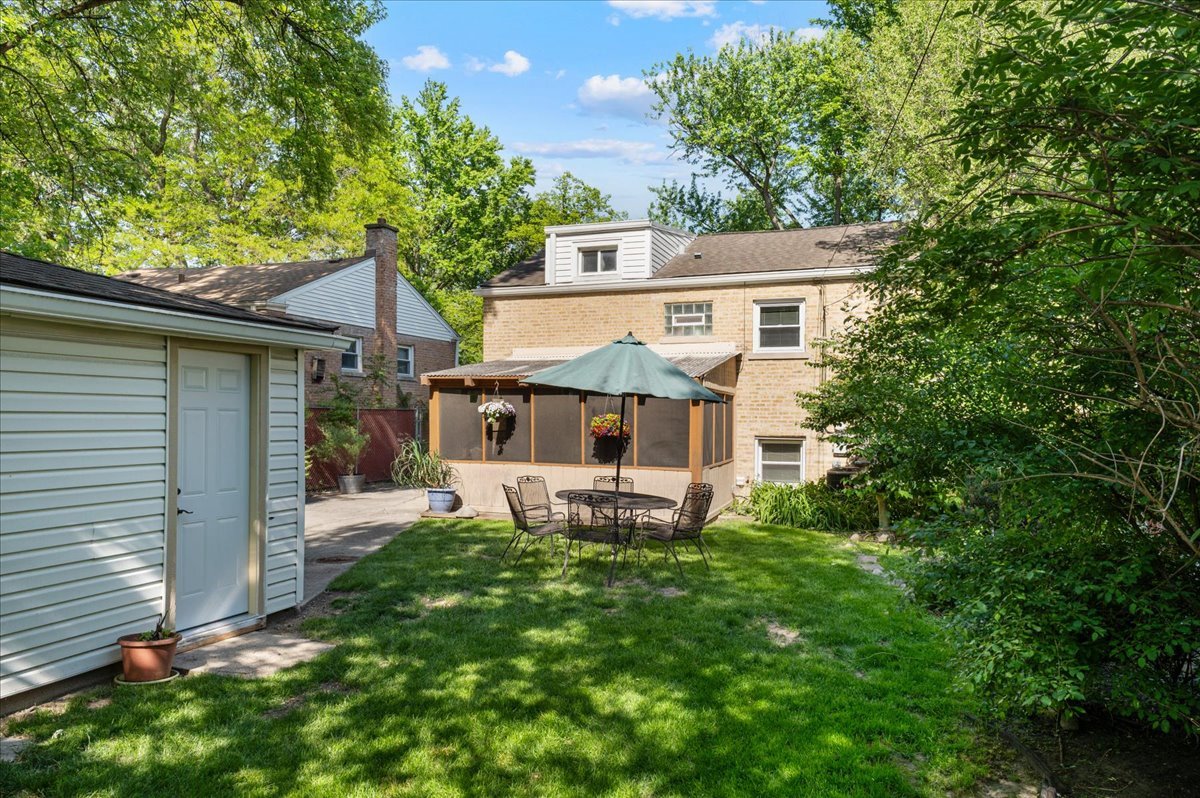 630 Long Road Glenview, IL 60025 - Photo 17 of 24 a view of a house with a yard and sitting area