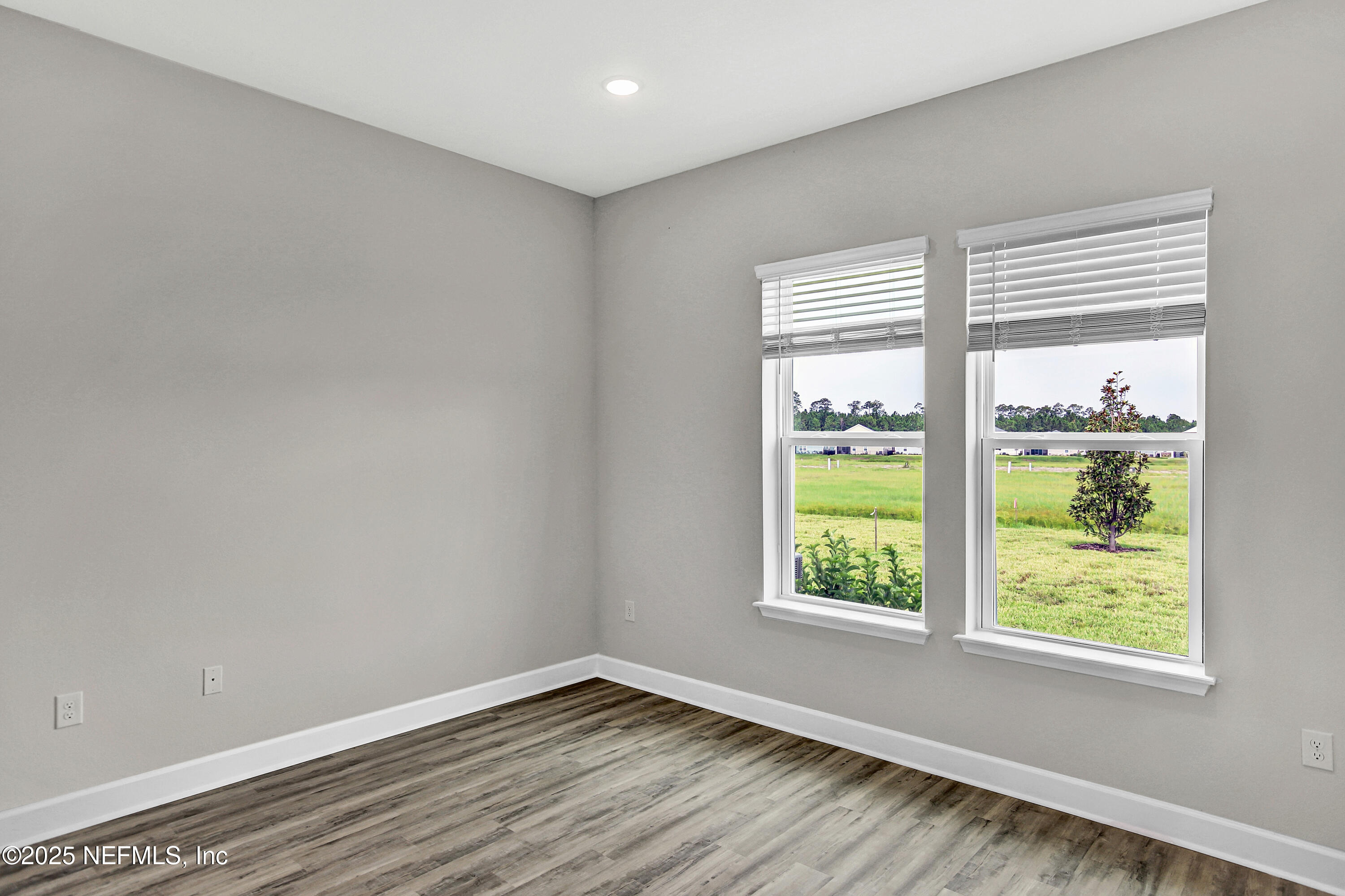 152 Day Dream Drive St. Augustine, FL 32092 - Photo 15 of 34 a view of an empty room with wooden floor and a window
