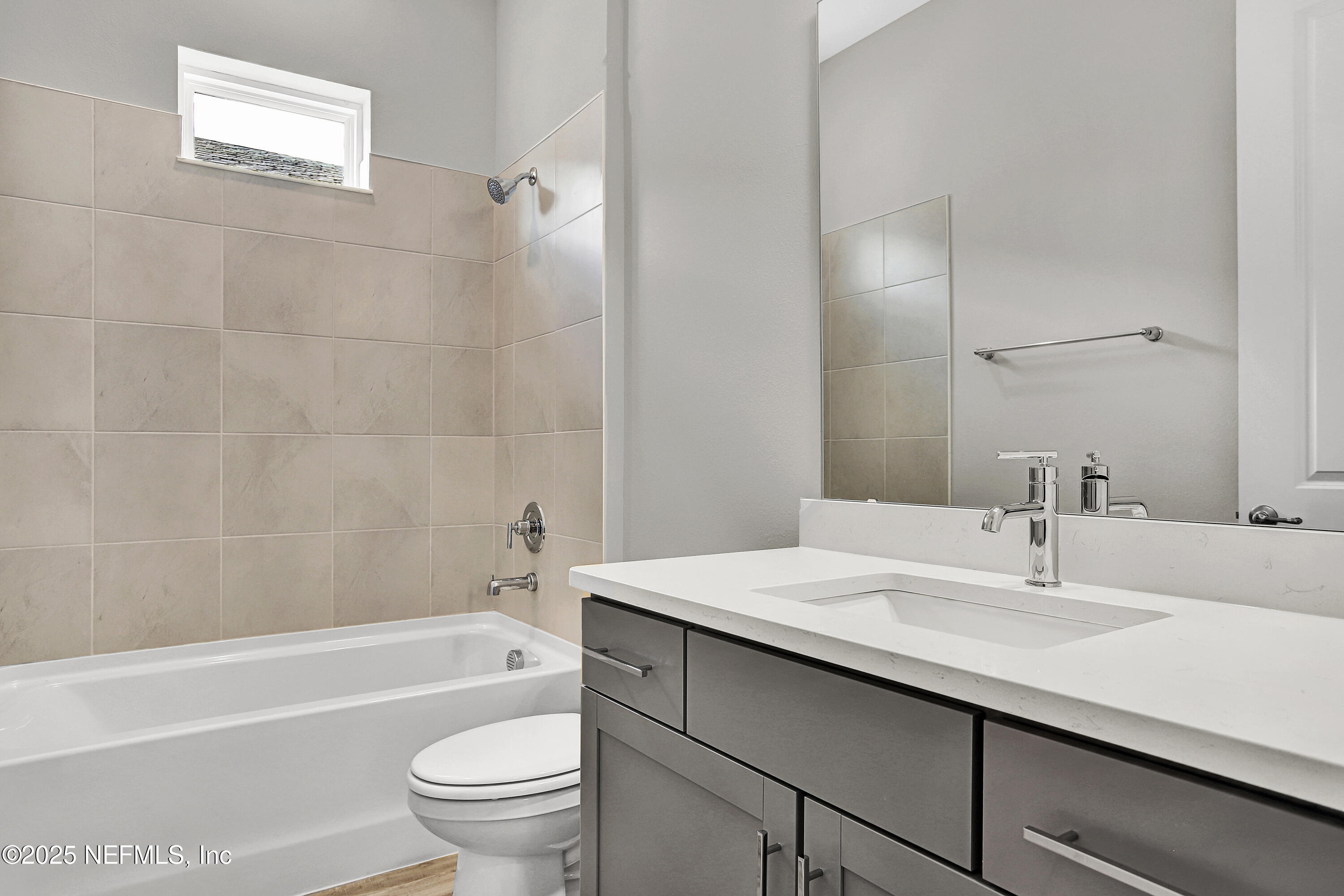 152 Day Dream Drive St. Augustine, FL 32092 - Photo 17 of 34 a bathroom with a sink a toilet and a bathtub