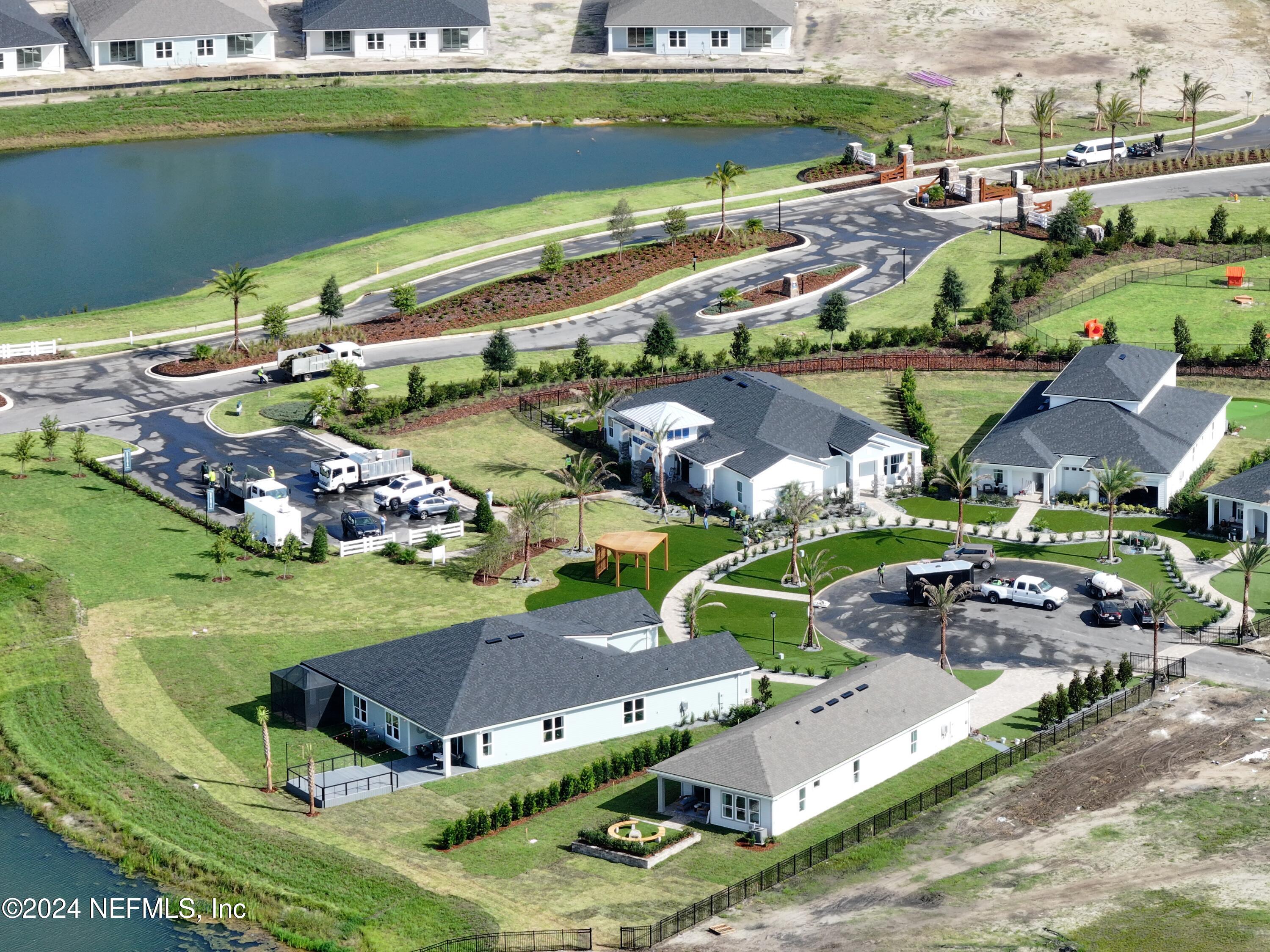 152 Day Dream Drive St. Augustine, FL 32092 - Photo 23 of 34 an aerial view of a house with a garden and lake view