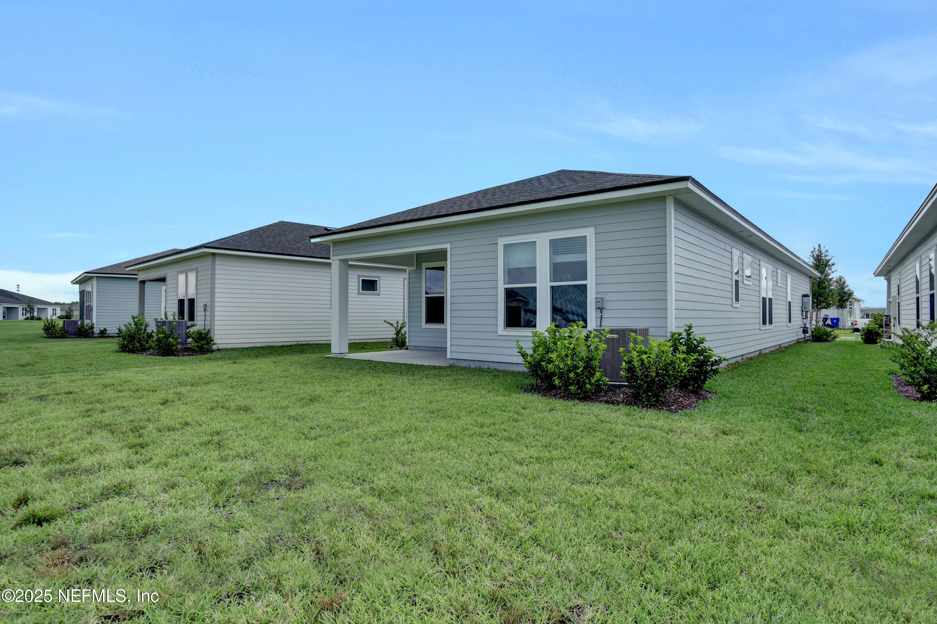 152 Day Dream Drive St. Augustine, FL 32092 - Photo 5 of 34 a view of a house with backyard and garden