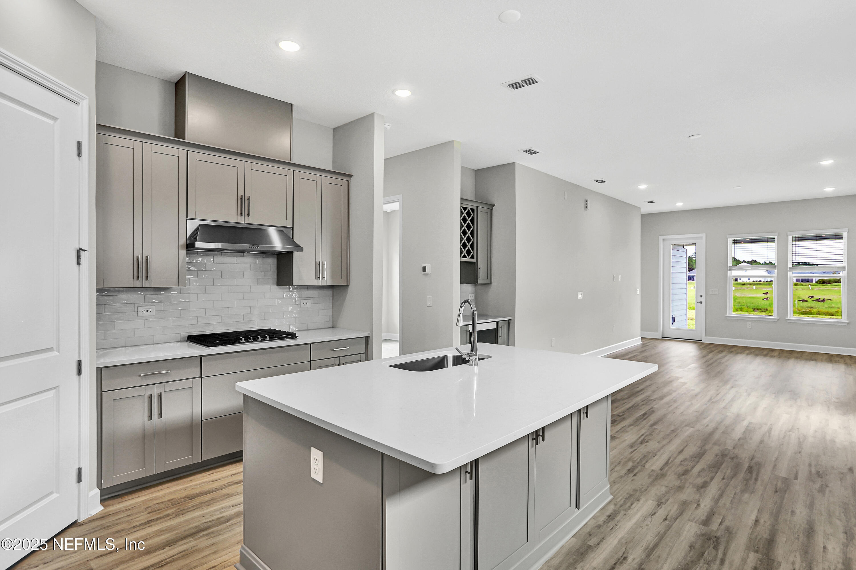 152 Day Dream Drive St. Augustine, FL 32092 - Photo 9 of 34 a kitchen with a sink stove and refrigerator