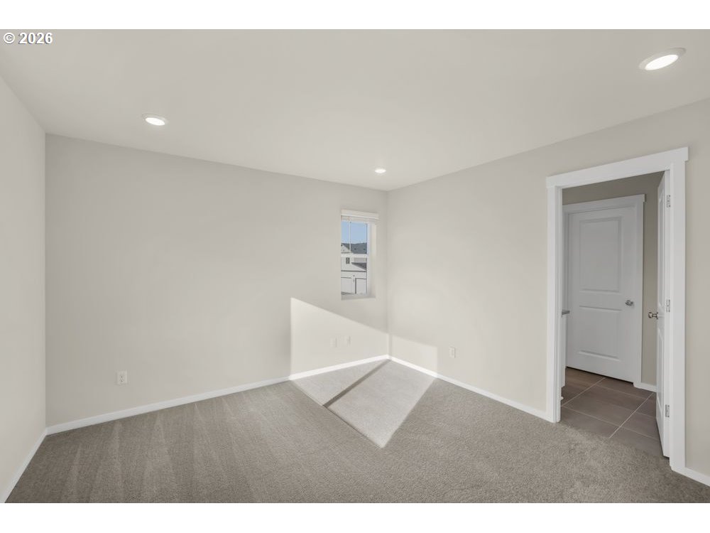 448 Southwest 32nd Street Battle Ground, WA 98604 - Photo 11 of 15 a view of an empty room with wooden floor