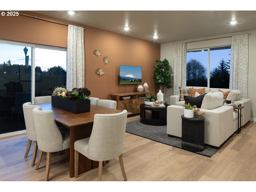 448 Southwest 32nd Street Battle Ground, WA 98604 - Photo 4 of 15 a living room with couches and a flat screen tv