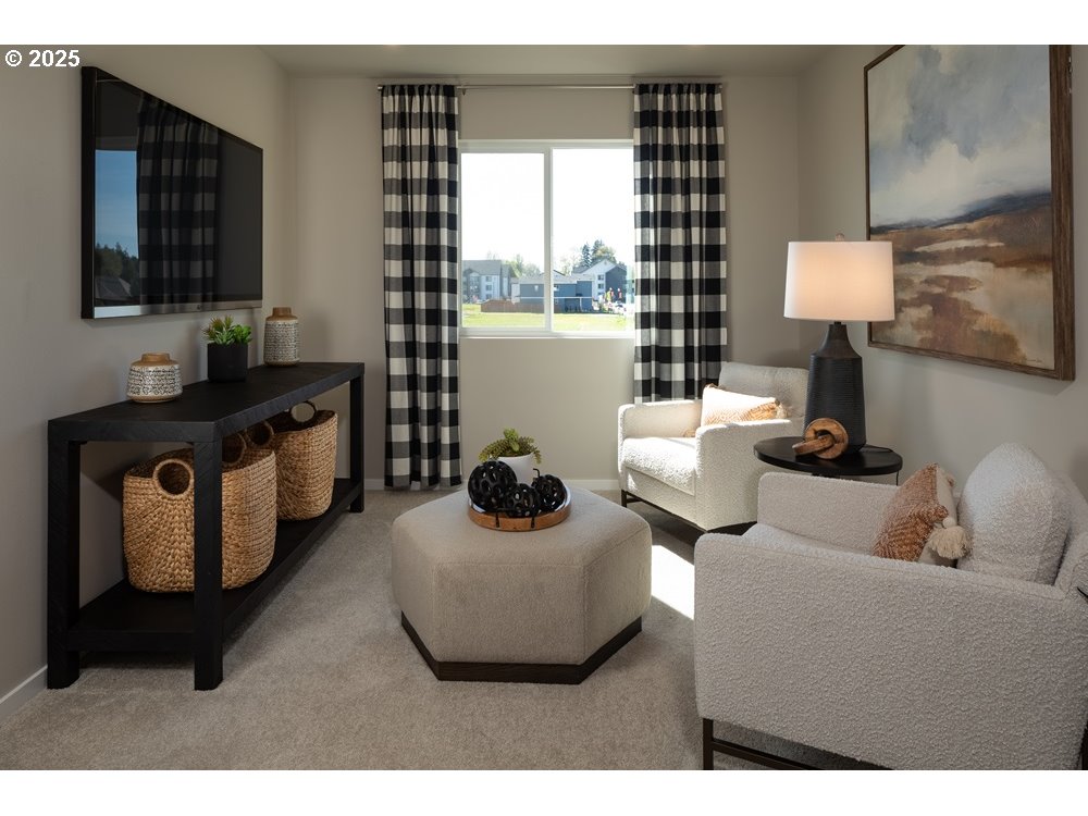 448 Southwest 32nd Street Battle Ground, WA 98604 - Photo 6 of 15 a living room with furniture and a flat screen tv