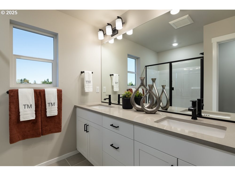 448 Southwest 32nd Street Battle Ground, WA 98604 - Photo 8 of 15 a bathroom with a double vanity sink and a mirror