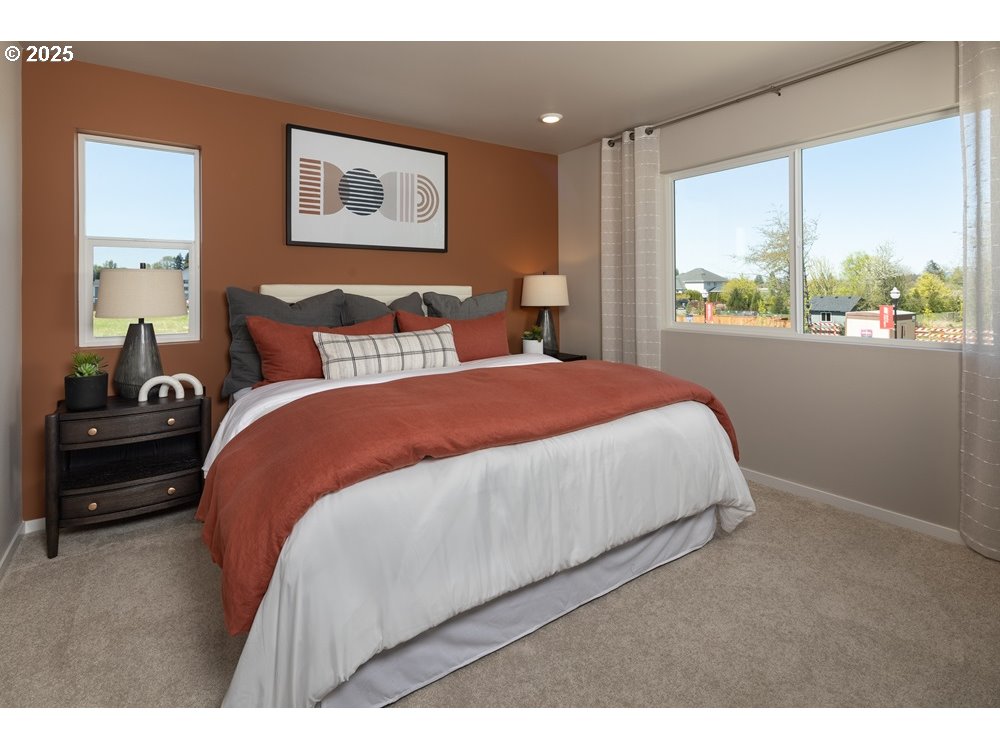 448 Southwest 32nd Street Battle Ground, WA 98604 - Photo 9 of 15 a bed sitting in a bedroom next to a window