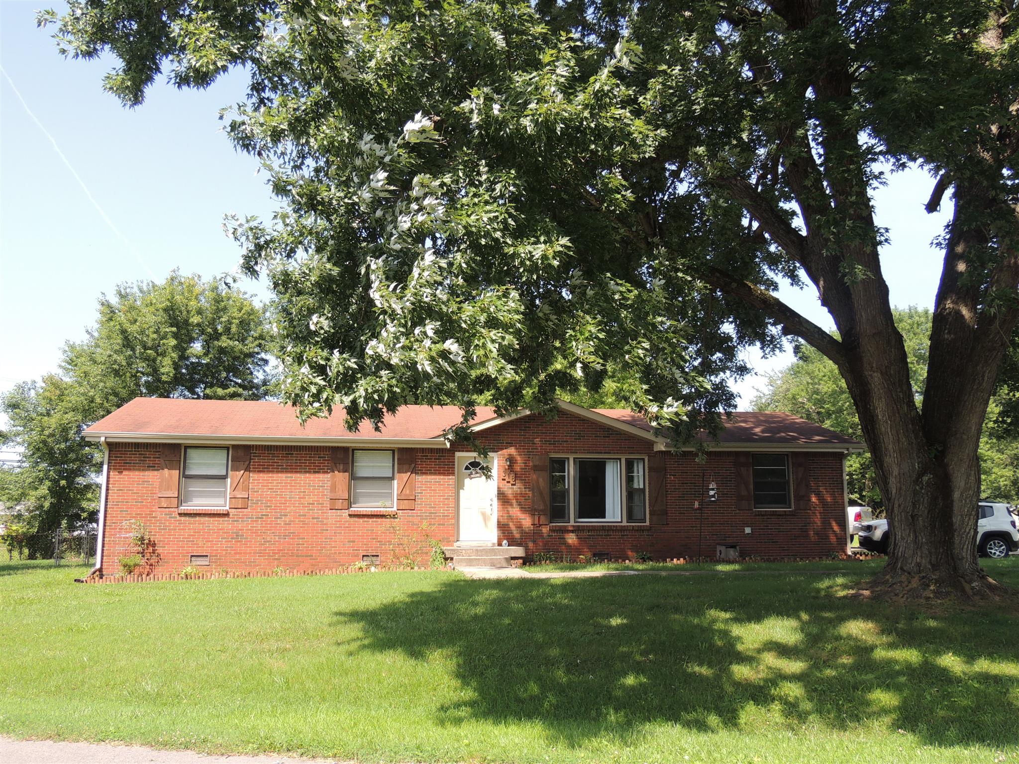 318 Notgrass Road Clarksville, TN 37042 - Photo 1 of 27 a front view of a house with a garden