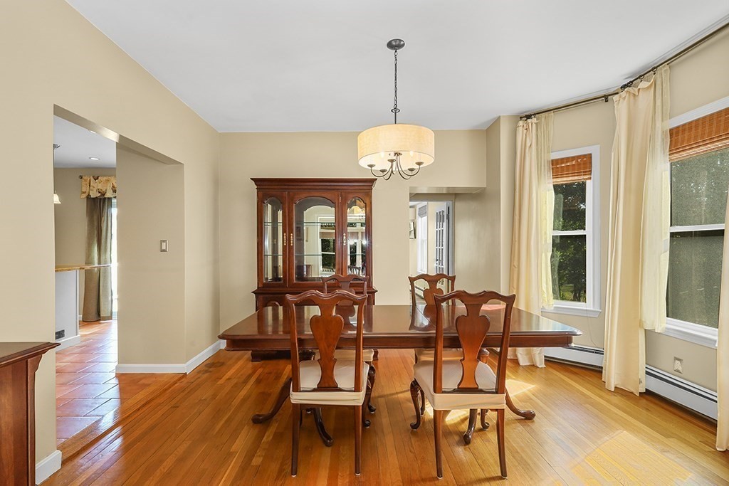 339 Winthrop Street Winthrop, MA 02152 - Photo 12 of 42 a view of a dining room with furniture wooden floor and chandelier