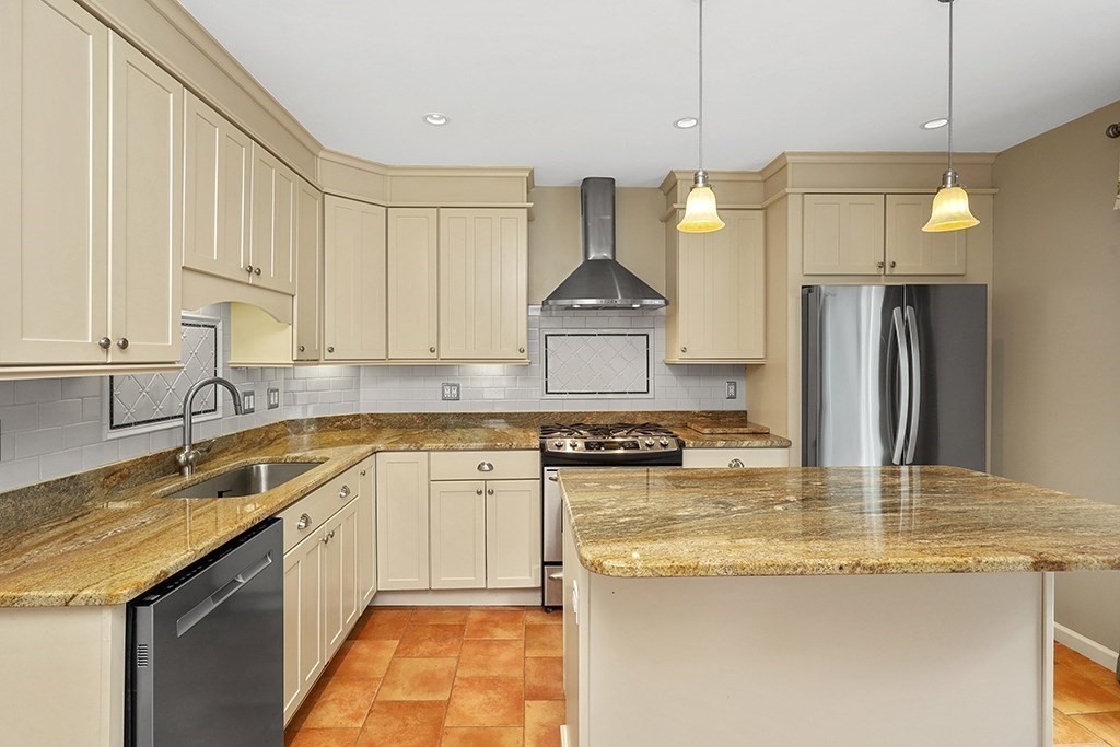 339 Winthrop Street Winthrop, MA 02152 - Photo 14 of 42 a kitchen with stainless steel appliances granite countertop a sink a stove and a refrigerator