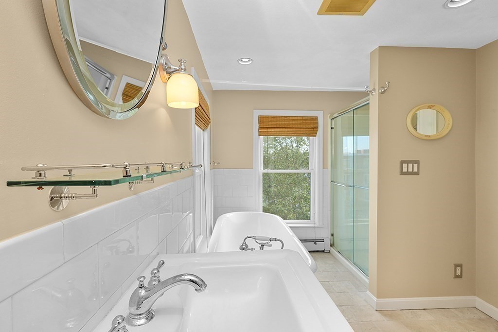 339 Winthrop Street Winthrop, MA 02152 - Photo 24 of 42 a bathroom with a tub and a window