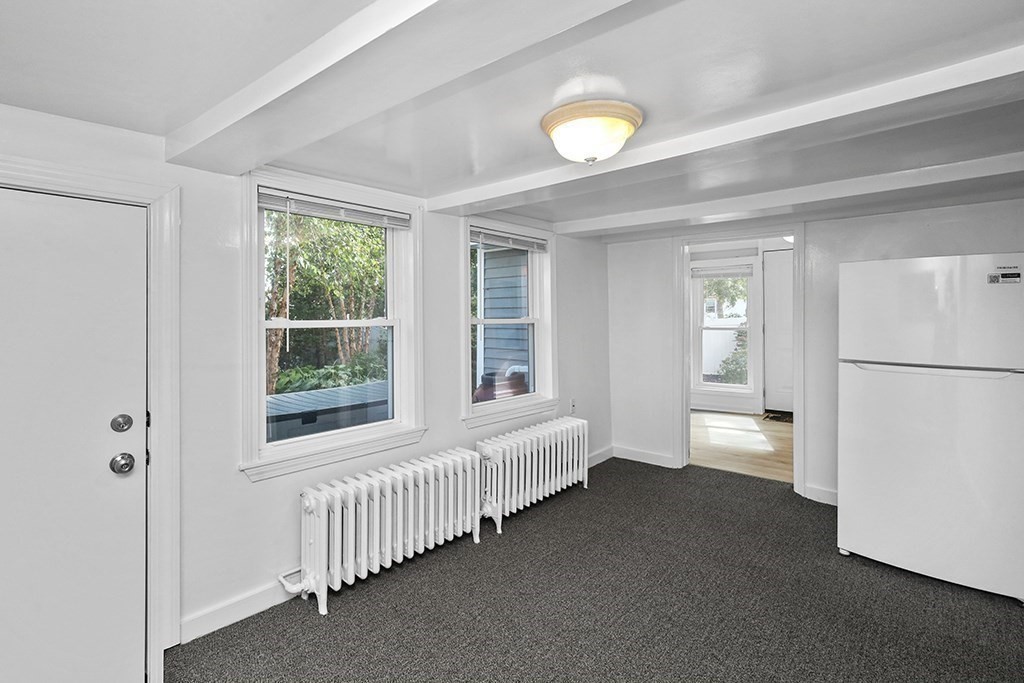 339 Winthrop Street Winthrop, MA 02152 - Photo 31 of 42 a view of an empty room with a window and wooden floor