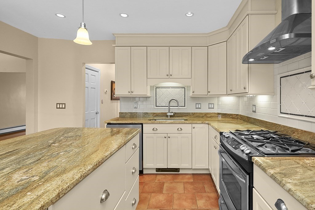 339 Winthrop Street Winthrop, MA 02152 - Photo 7 of 42 a kitchen with granite countertop a sink stove and refrigerator