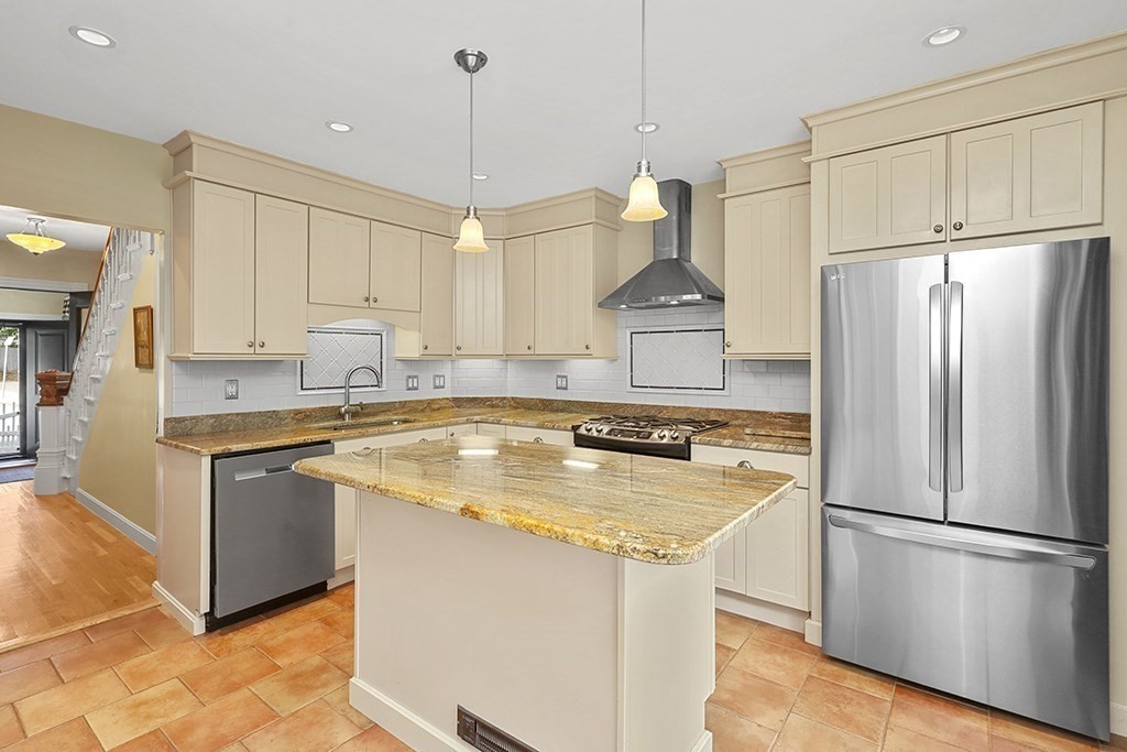 339 Winthrop Street Winthrop, MA 02152 - Photo 10 of 42 a kitchen with stainless steel appliances granite countertop a refrigerator a sink a stove a microwave and a refrigerator