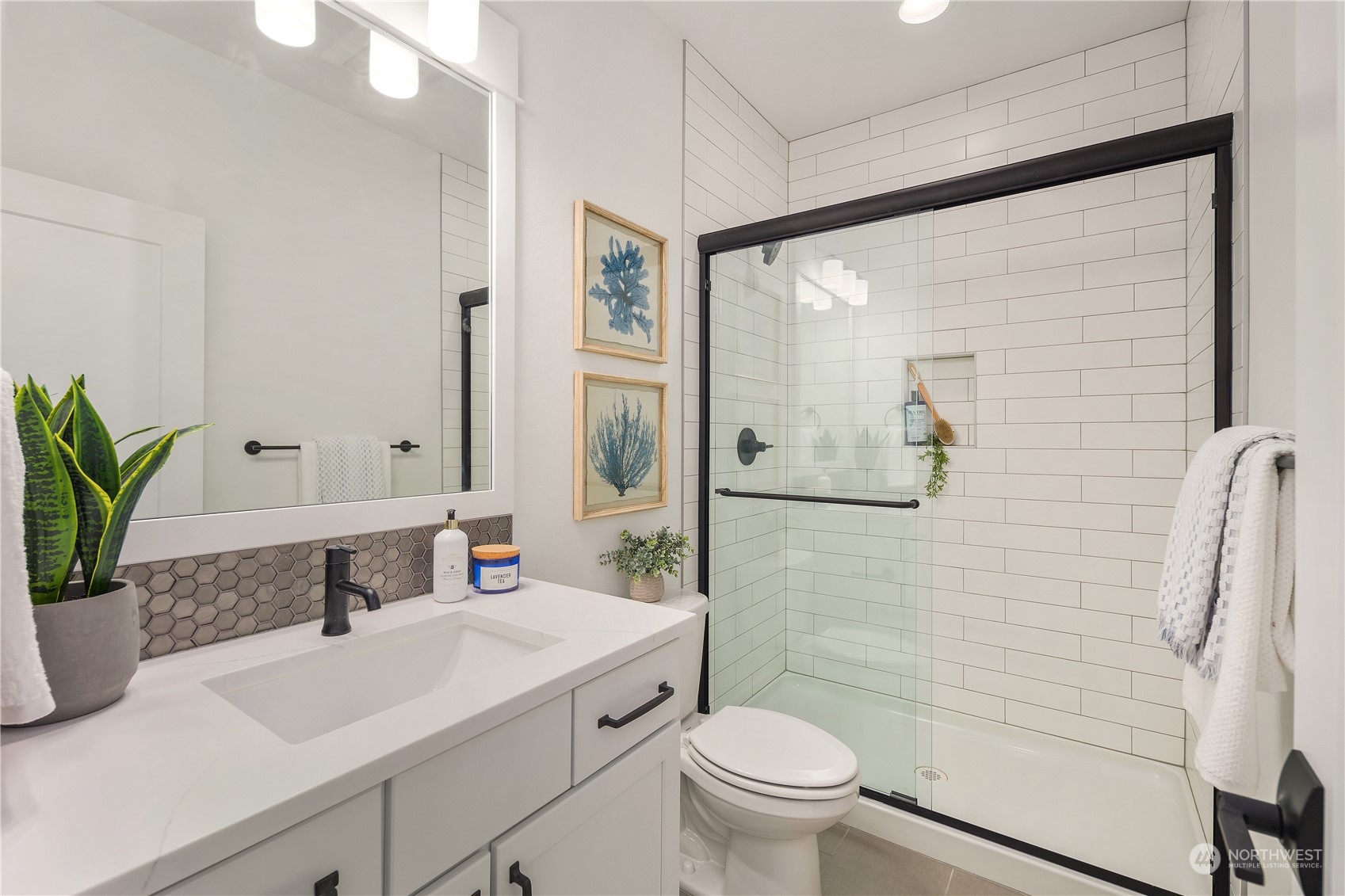 4001 211th Place Southeast Bothell, WA 98021 - Photo 10 of 26 a bathroom with a sink toilet and shower