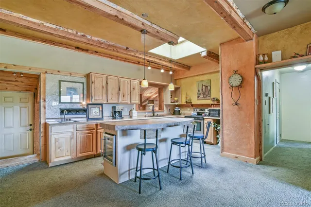 a large kitchen with a table and chairs