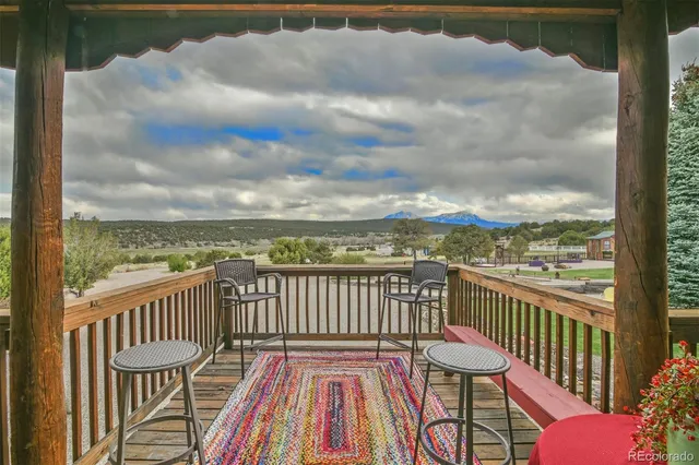 a view of a chair and table on the balcony