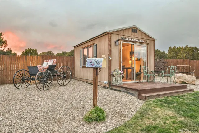 a view of a house with porch and furniture