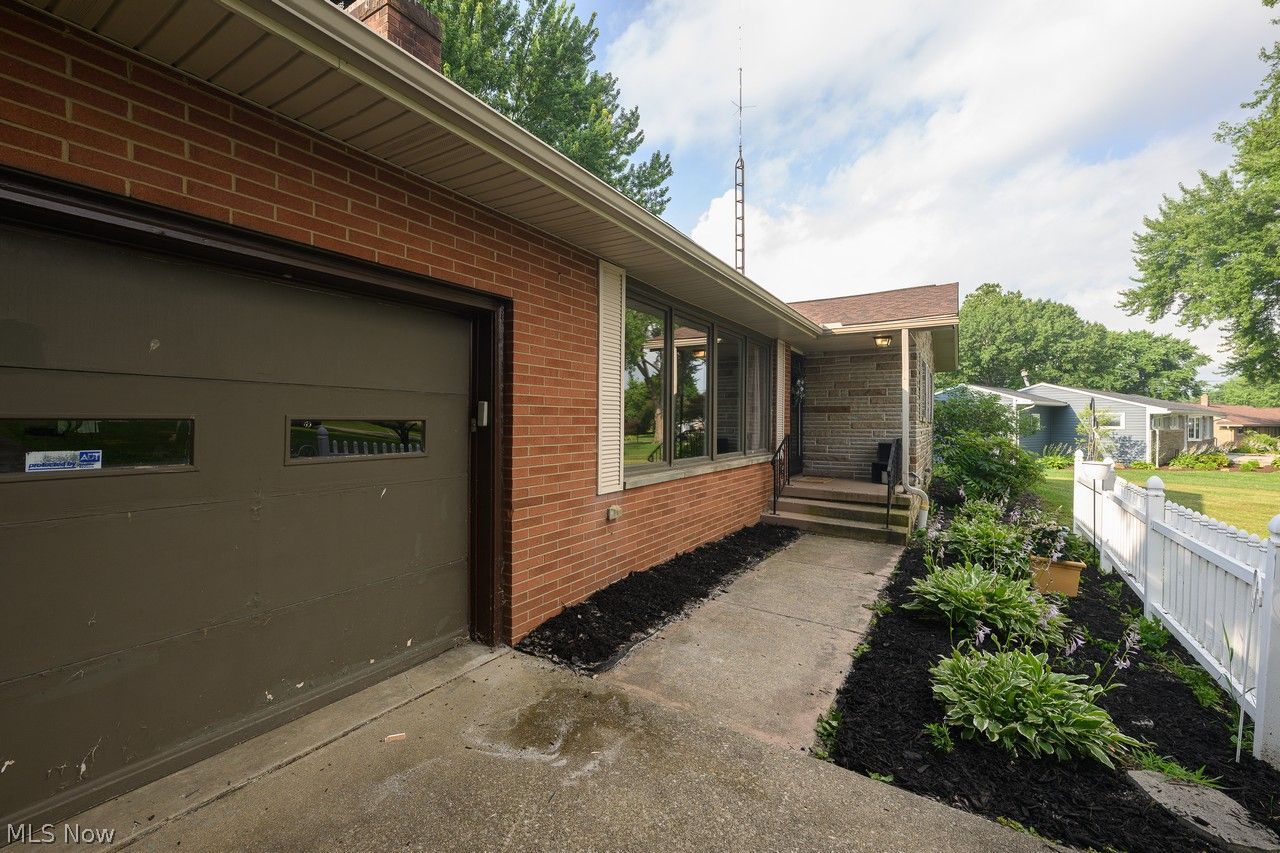 3912 Rolling Ridge Road Northeast Canton, OH 44721 - Photo 22 of 33 Paved walkway to covered front entry