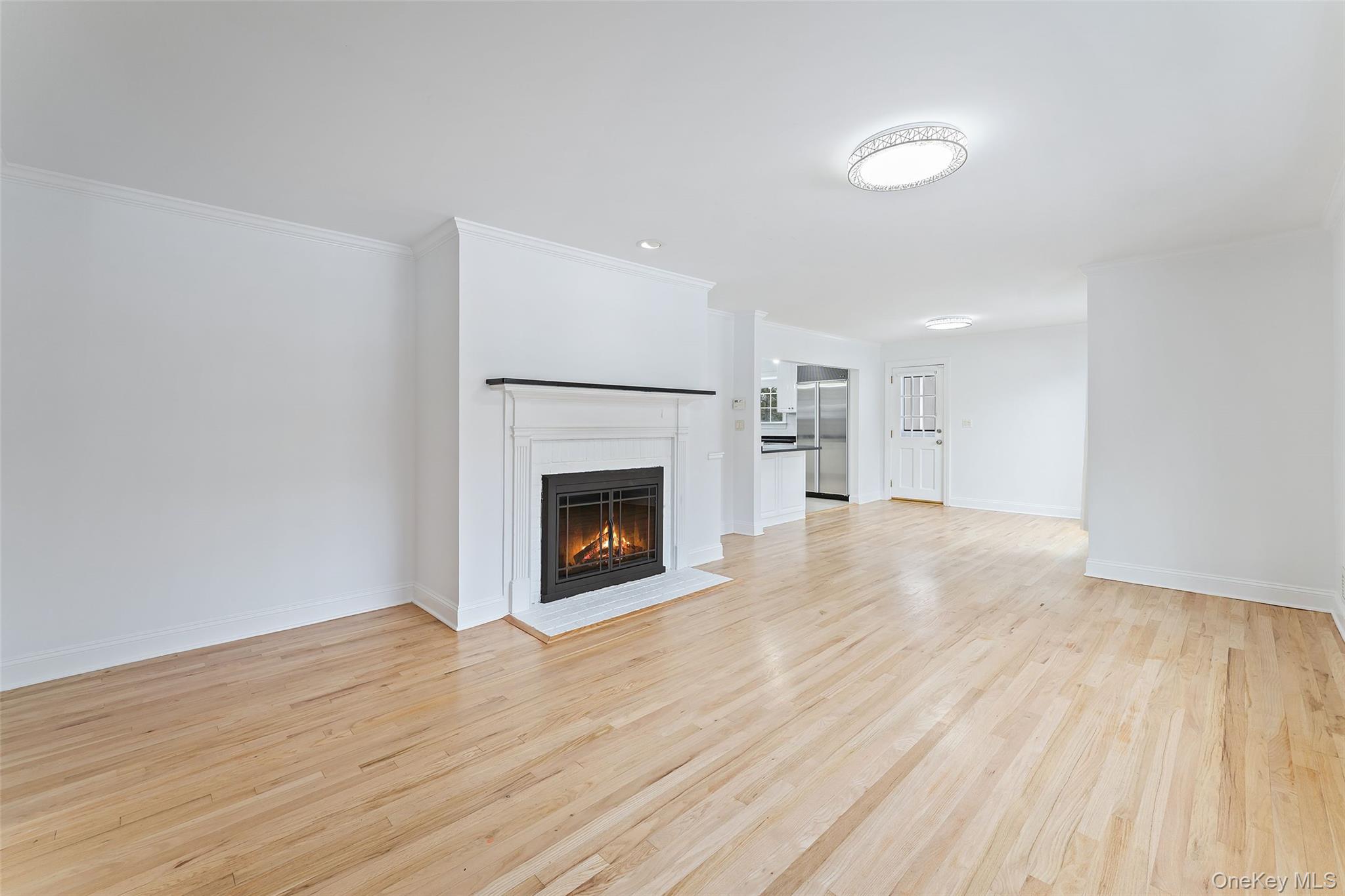 14 Wakefield Road Scarsdale, NY 10583 - Photo 5 of 27 Den with wood burning fireplace.
