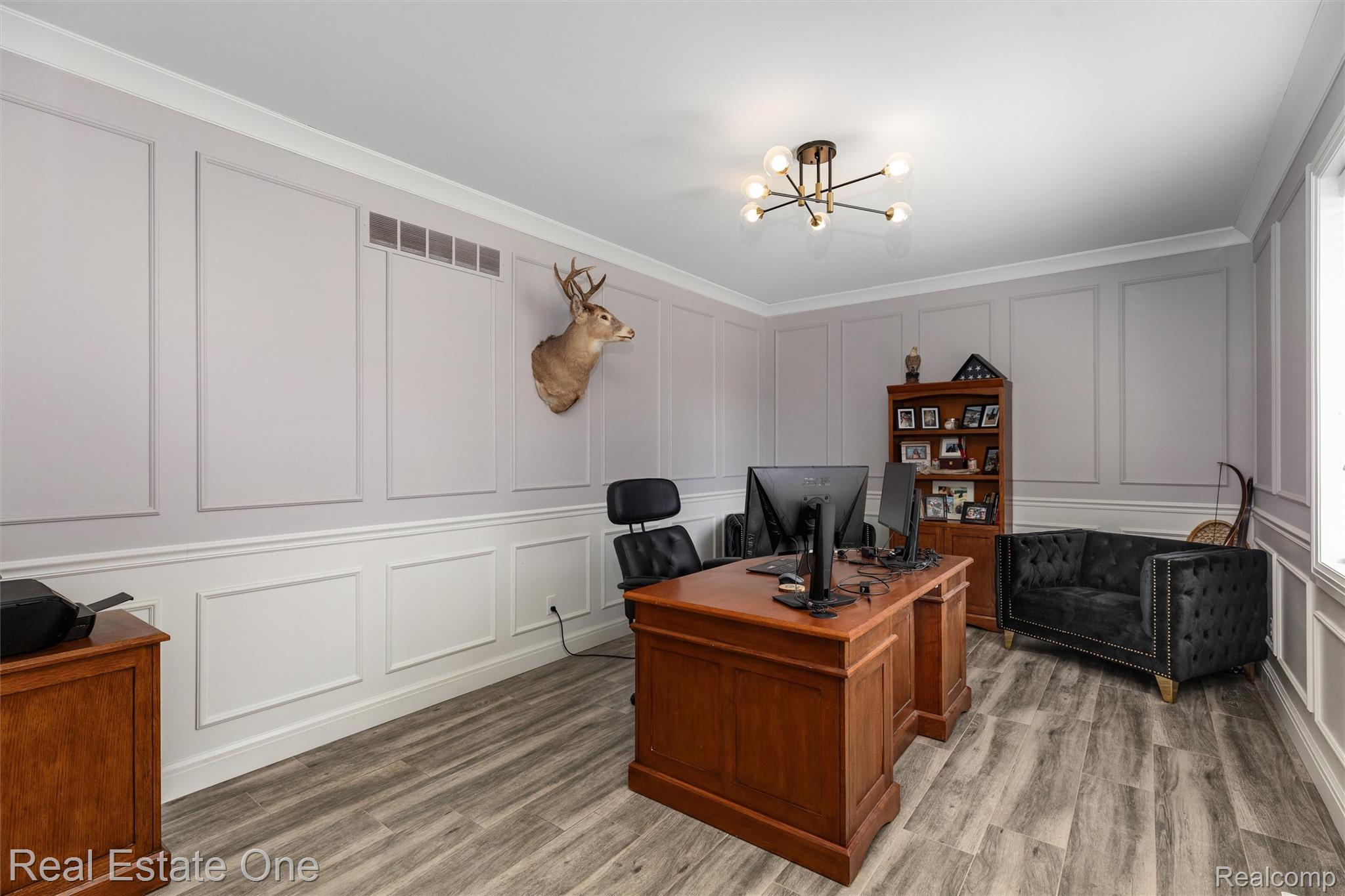 2983 28 Mile Road Washington, MI 48094 - Photo 8 of 54 Spacious room featuring elegant wainscoting and crown molding