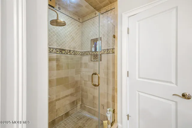 a view of a house with a big yard and large trees