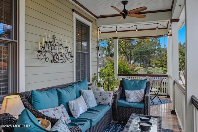 a balcony with chairs and wooden floor