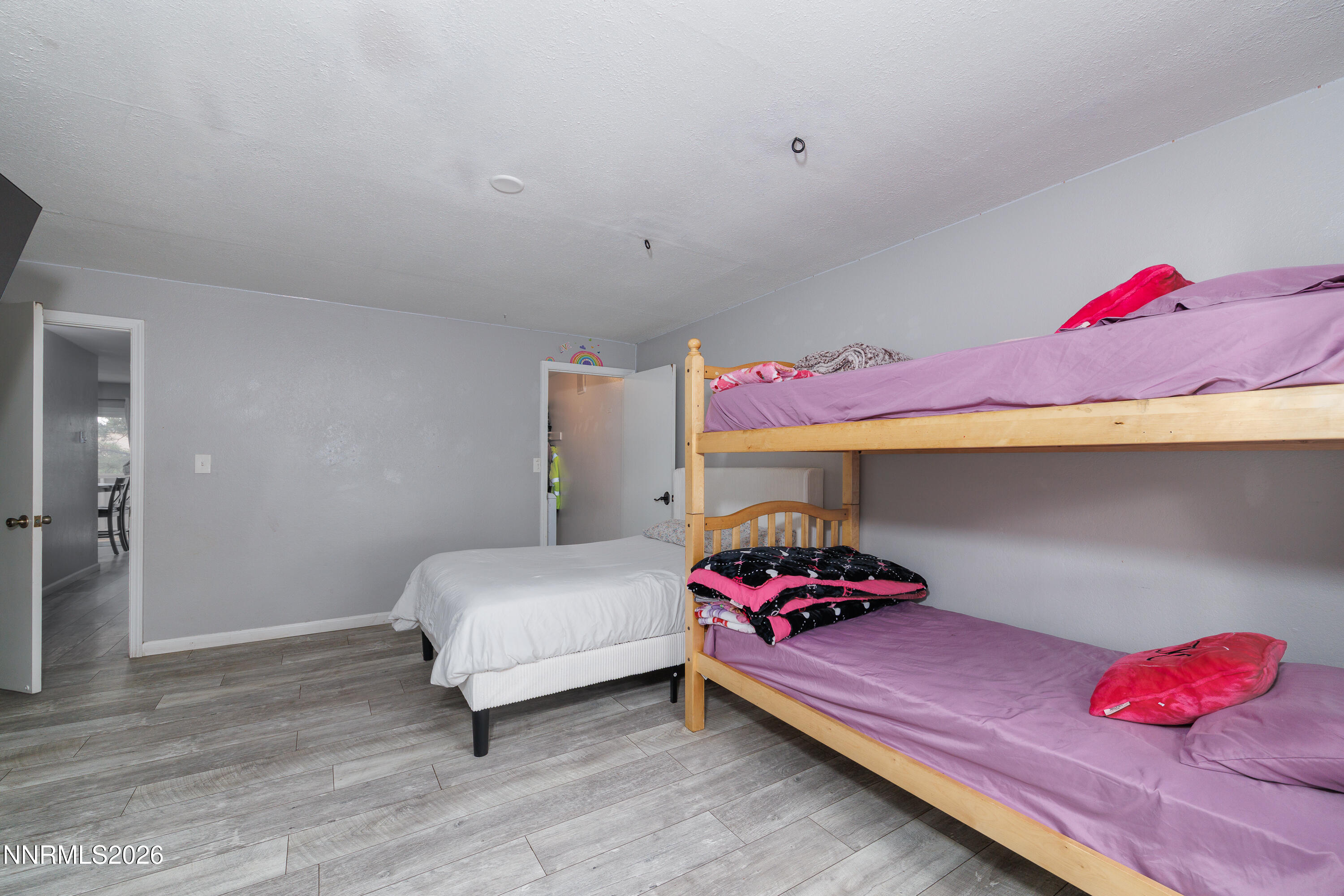 3935 Clear Acre Lane, Unit 214 Reno, NV 89512 - Photo 5 of 15 a bedroom with a bed and a lamp