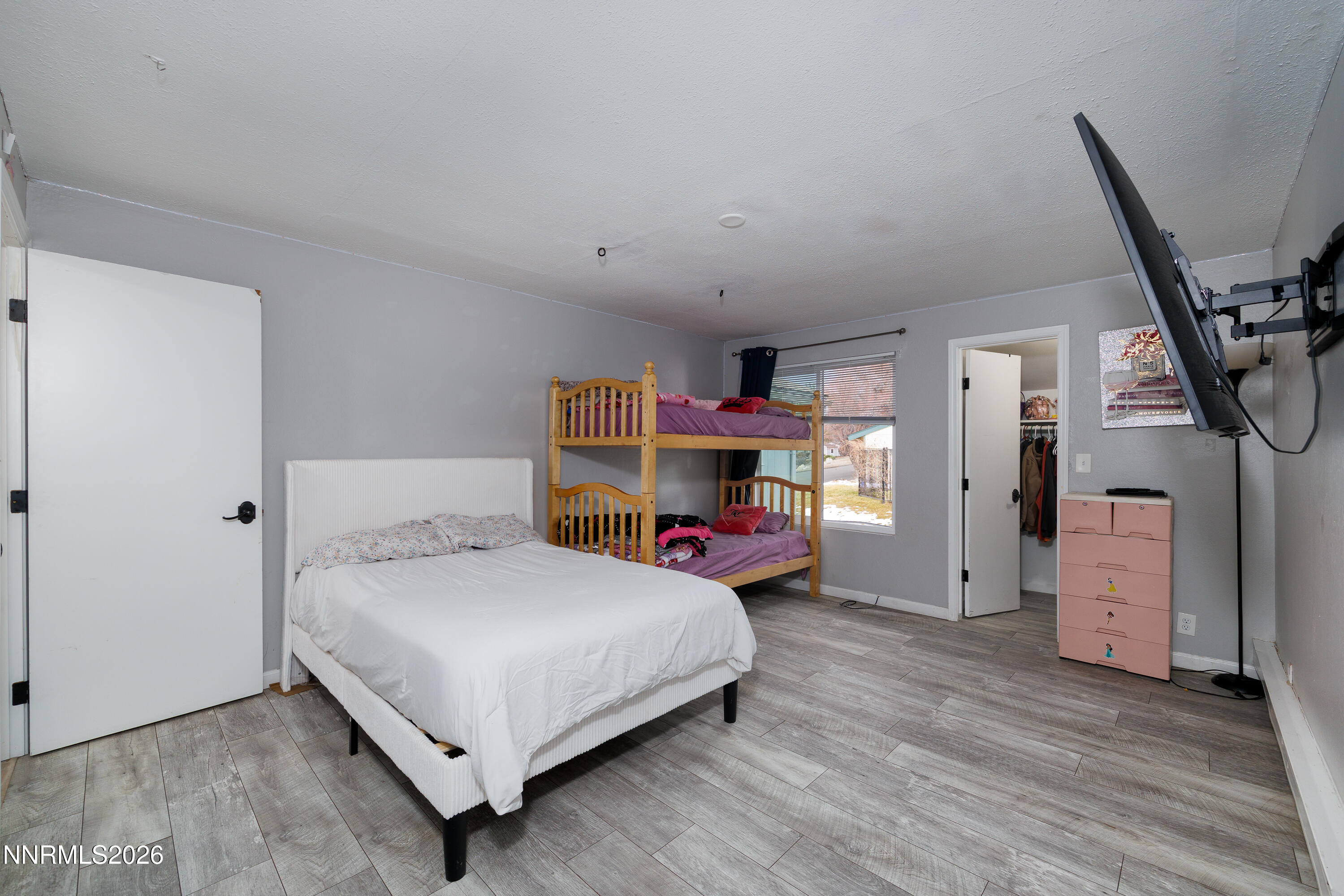 3935 Clear Acre Lane, Unit 214 Reno, NV 89512 - Photo 6 of 15 a bedroom with a bed and a desk