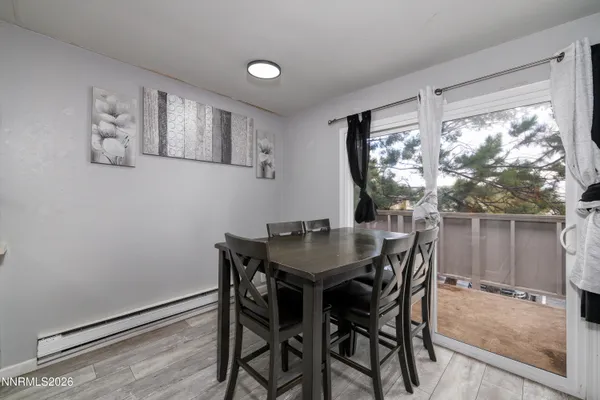 a view of a dining room with furniture window and outside view