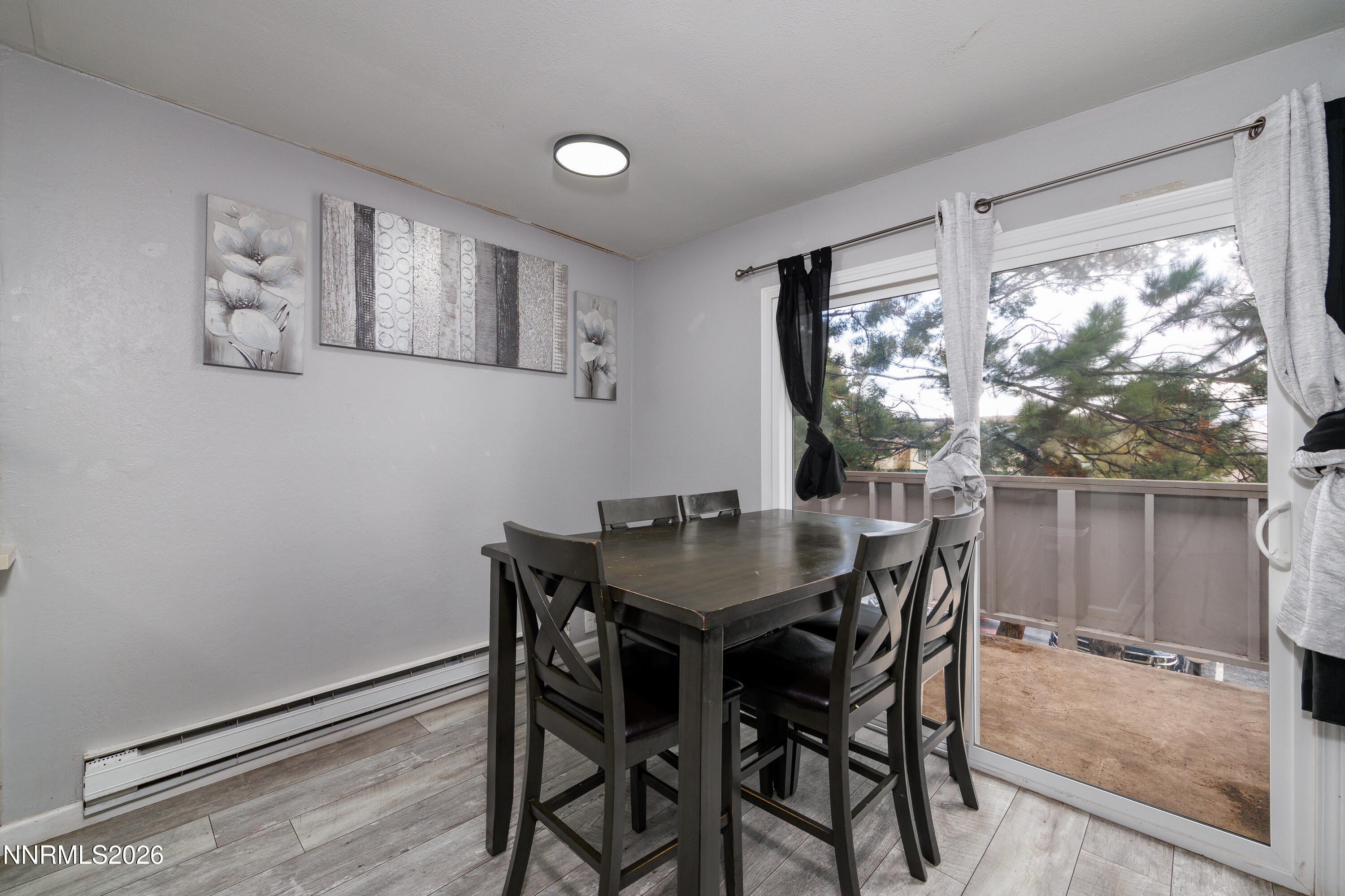 3935 Clear Acre Lane, Unit 214 Reno, NV 89512 - Photo 10 of 15 a view of a dining room with furniture window and outside view