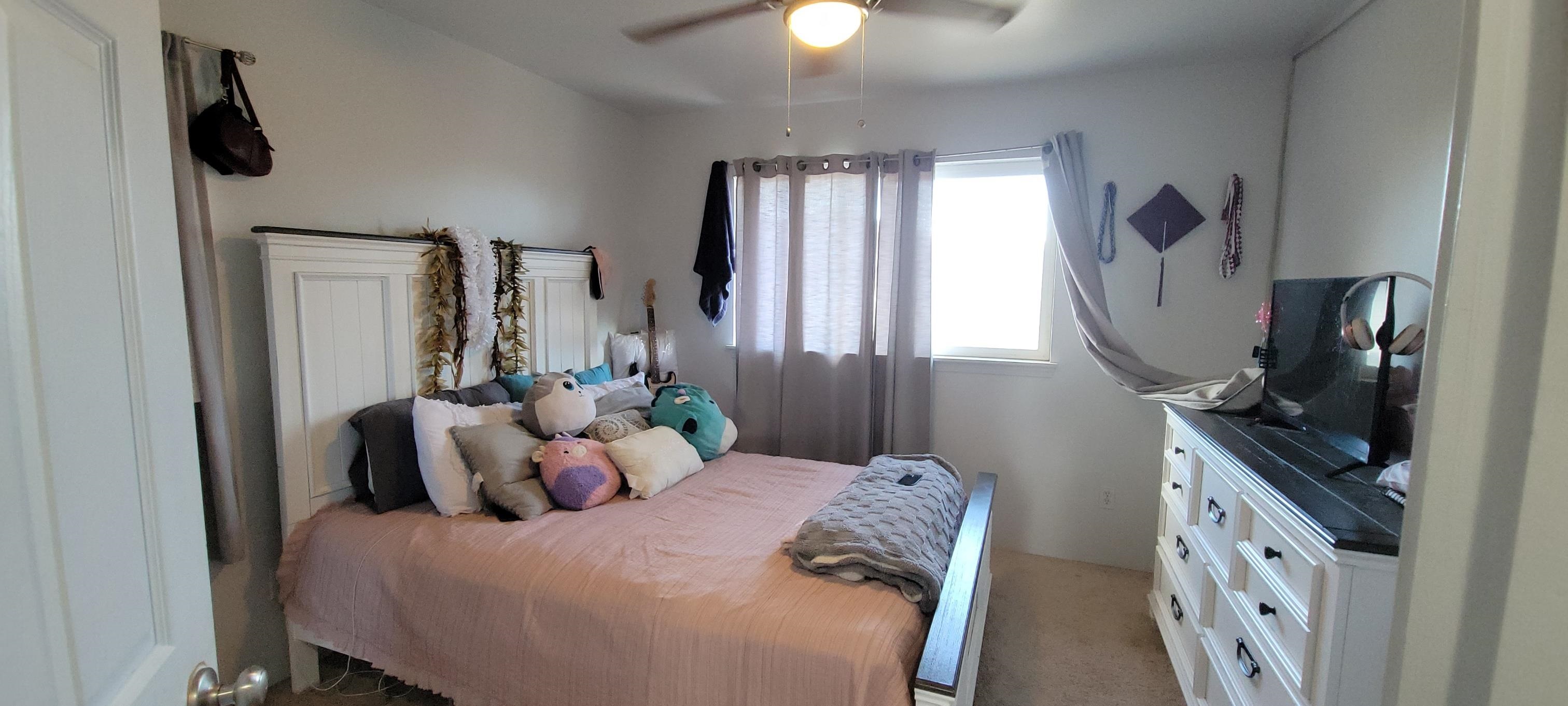 10 West Makahehi Loop Kahului, HI 96732 - Photo 11 of 18 a bedroom with bed mirror and window