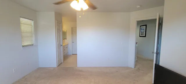an empty room that has a mirror in it