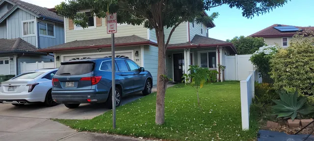 a view of a car in front of house