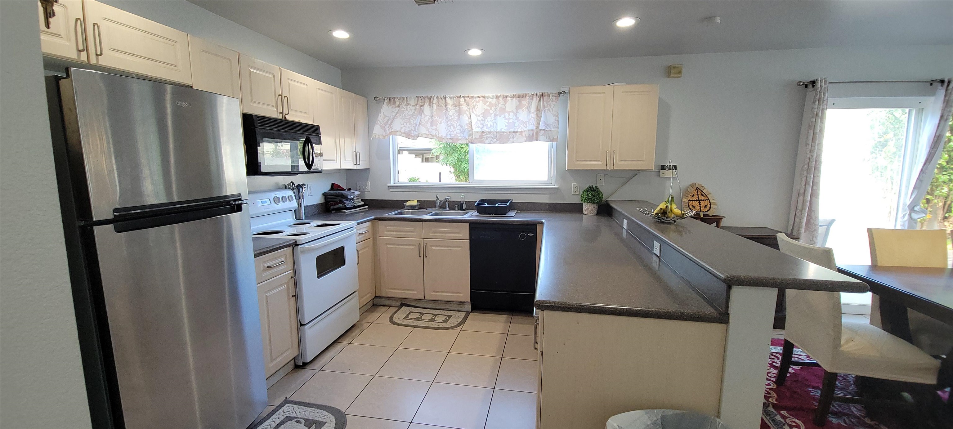 10 West Makahehi Loop Kahului, HI 96732 - Photo 6 of 18 a kitchen with a sink appliances cabinets and a counter top space
