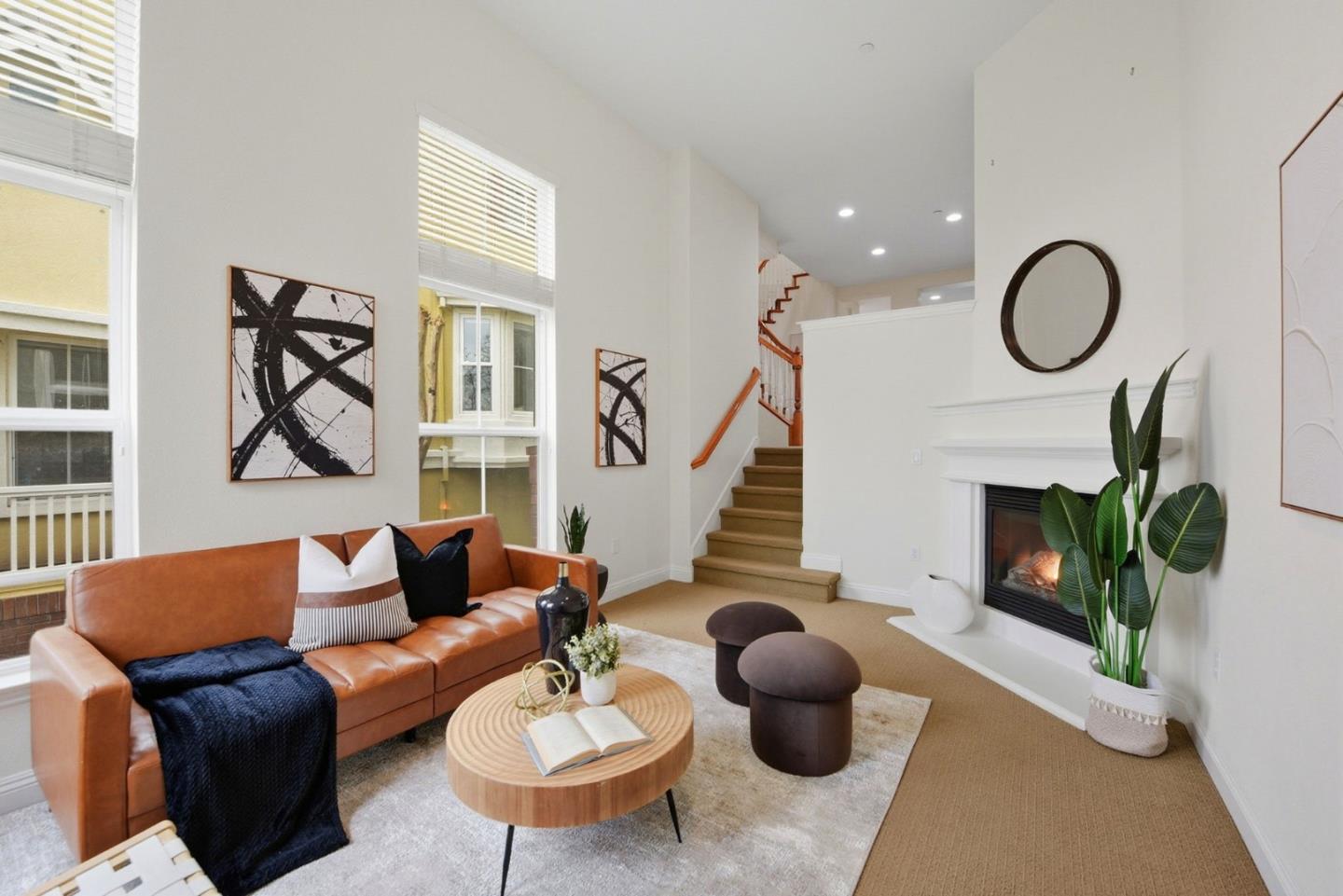48962 Woodgrove Common Fremont, CA 94539 - Photo 1 of 36 a living room with furniture potted plant and a fireplace