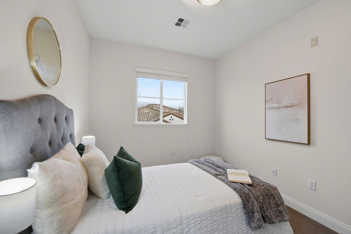 48962 Woodgrove Common Fremont, CA 94539 - Photo 17 of 36 a bedroom with a bed and a painting on the wall