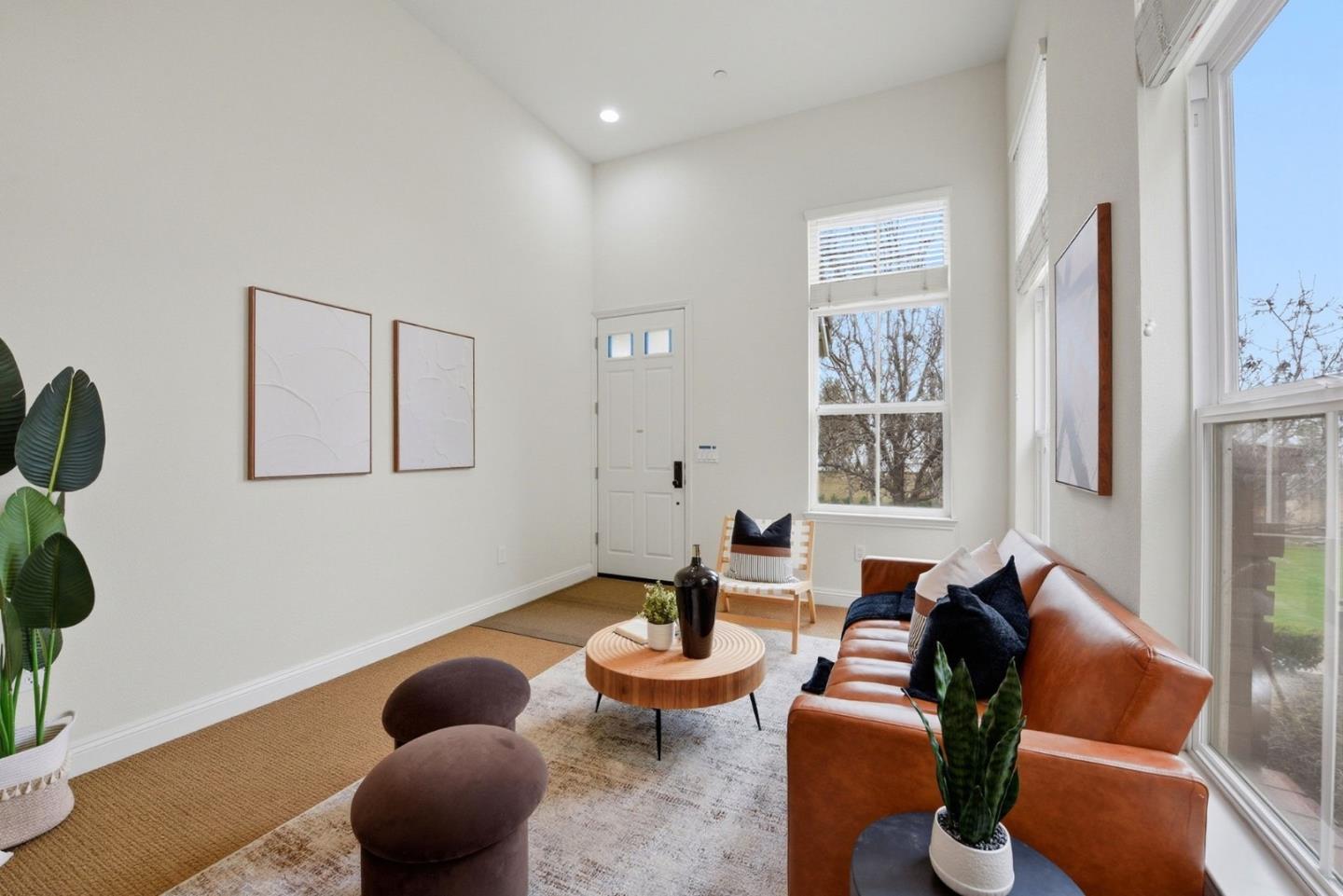 48962 Woodgrove Common Fremont, CA 94539 - Photo 2 of 36 a living room with furniture potted plant and a large window