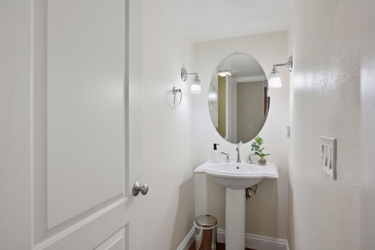 48962 Woodgrove Common Fremont, CA 94539 - Photo 21 of 36 a bathroom with a sink and a mirror