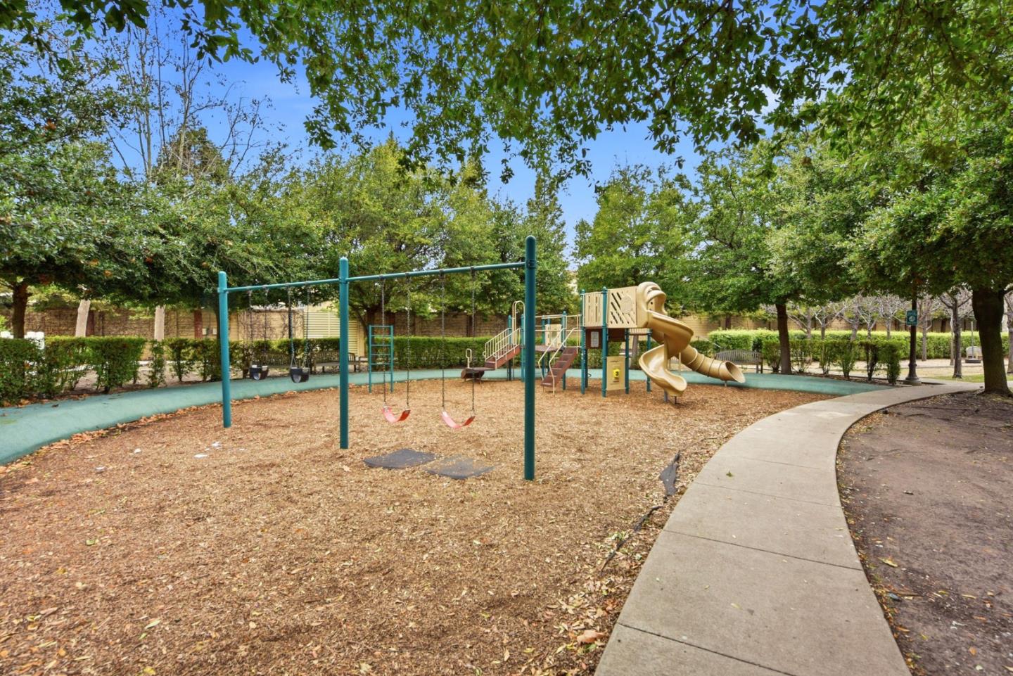 48962 Woodgrove Common Fremont, CA 94539 - Photo 26 of 36 a view of a park with swings